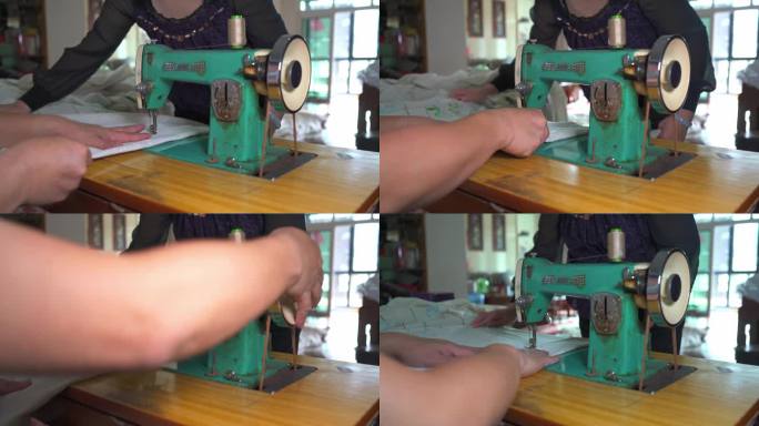 一位裁缝在使用传统缝纫机缝制窗帘