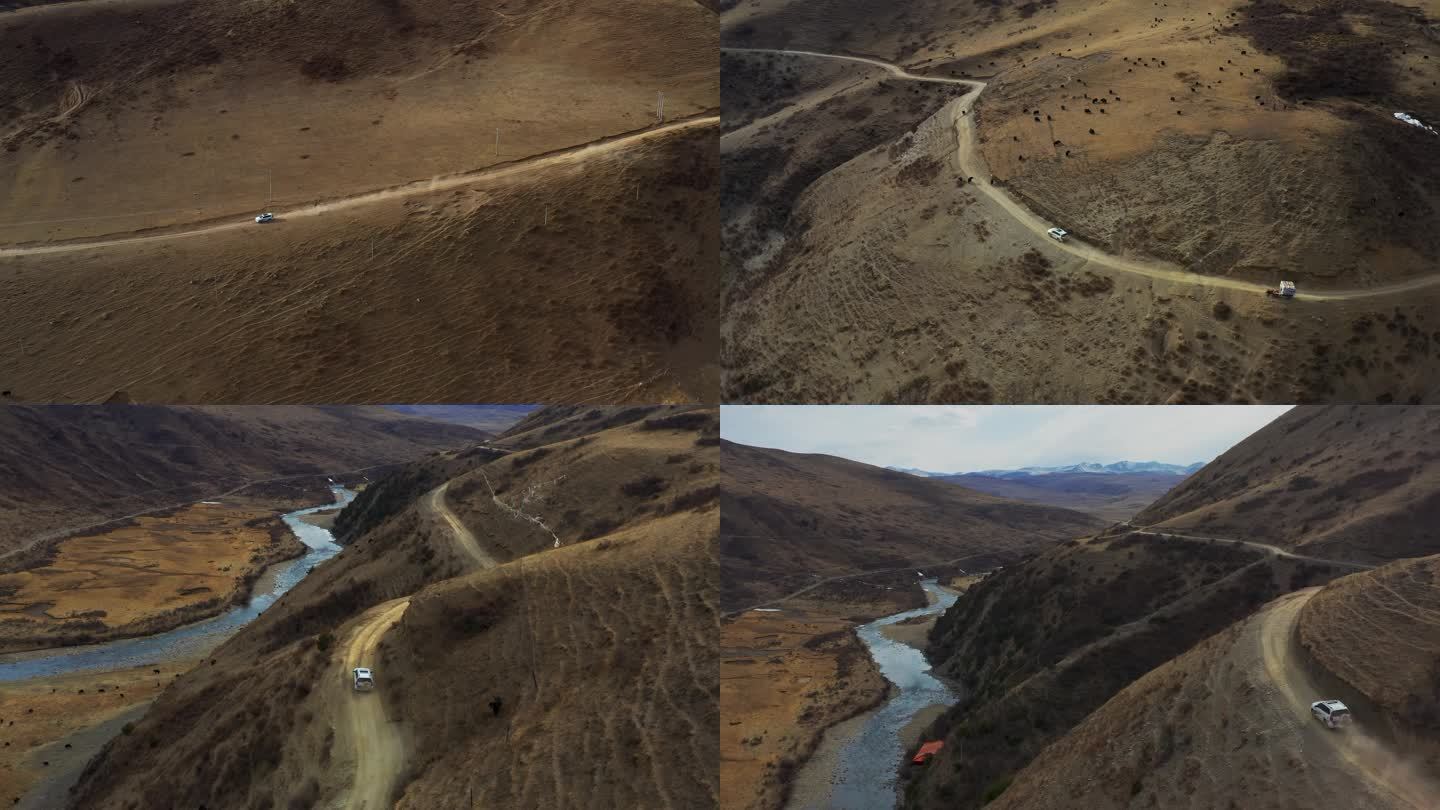 航拍越野车行驶在高原草甸半山腰的公路上