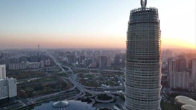夕阳朝阳下航拍郑州地标CBD大玉米楼空镜