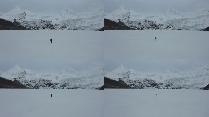 航拍一个人行走在结冰的萨普冰川湖面上