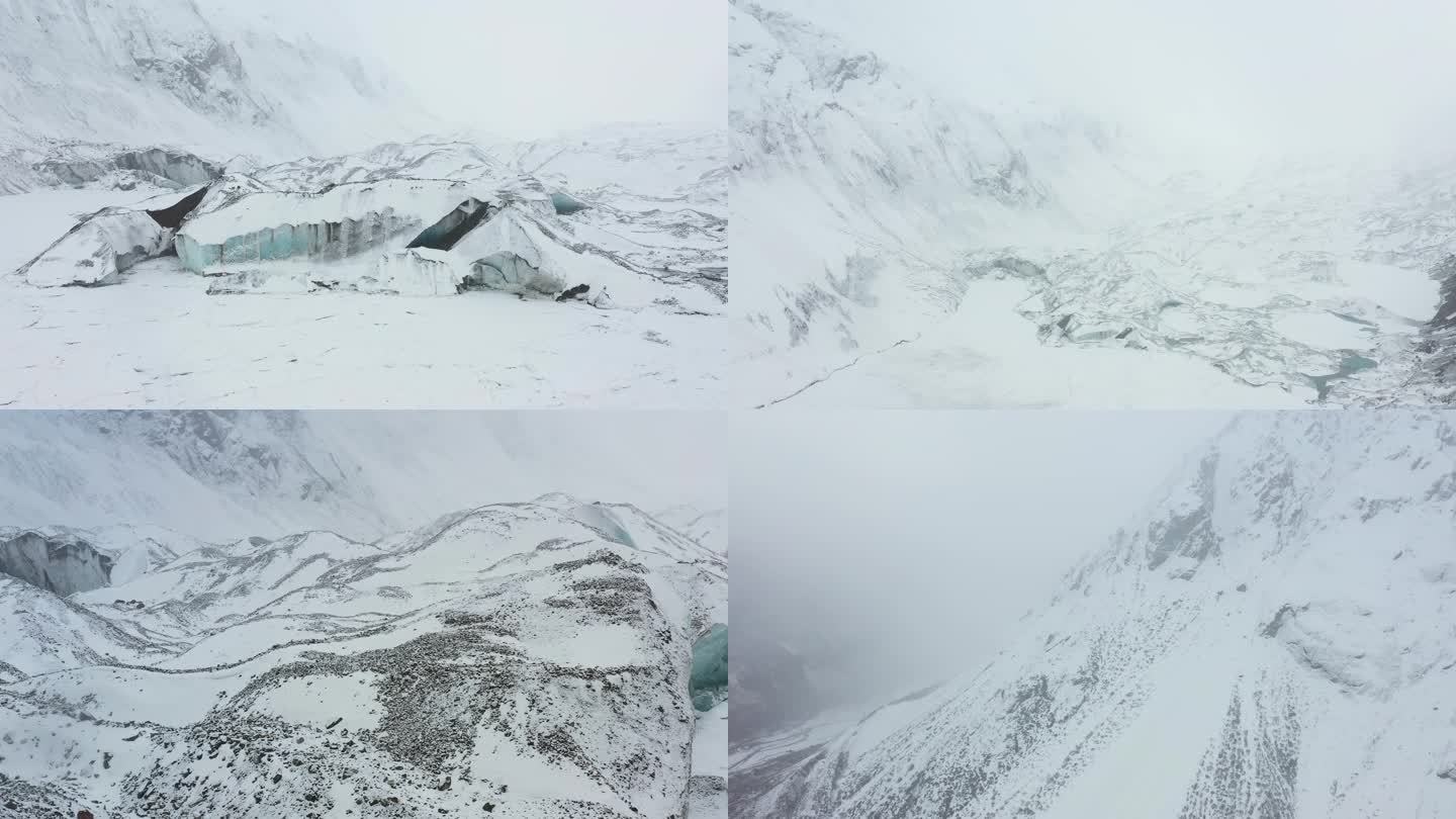 航拍大雪纷飞的西藏边坝县普玉冰川