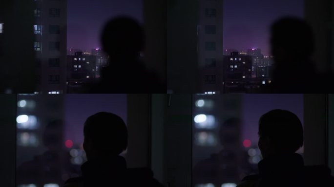 夜晚一个人看着窗外