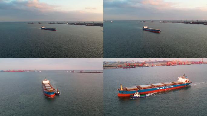 航拍夕阳下集装箱码头进港的货轮