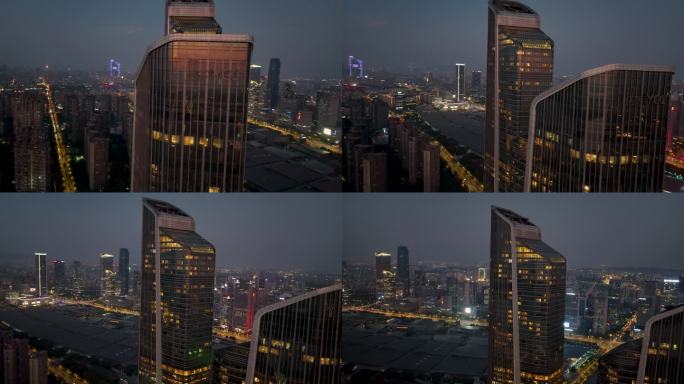 航拍落日夜幕下的南京地表双子塔建筑