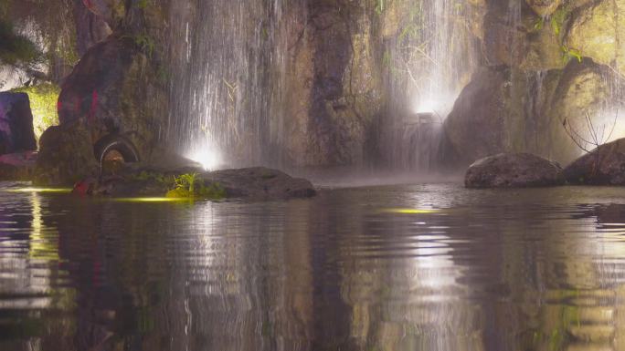 夜晚水乡公园灯光瀑布灯光夜景