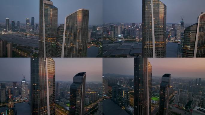 航拍落日夜幕下的南京地表双子塔建筑