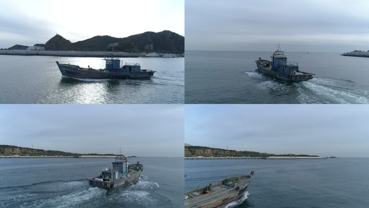 渔船从码头驶向大海