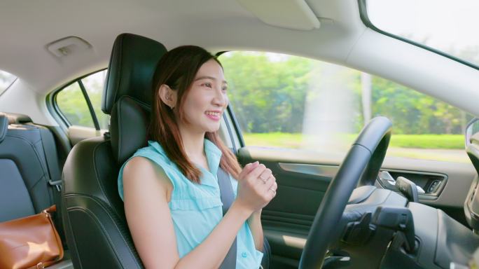 亚洲年轻女子开车美女开车智能汽车5g时代