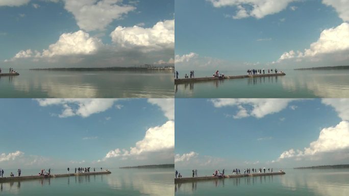 滇池海晏码头蓝天白云倒影在平静水平面上