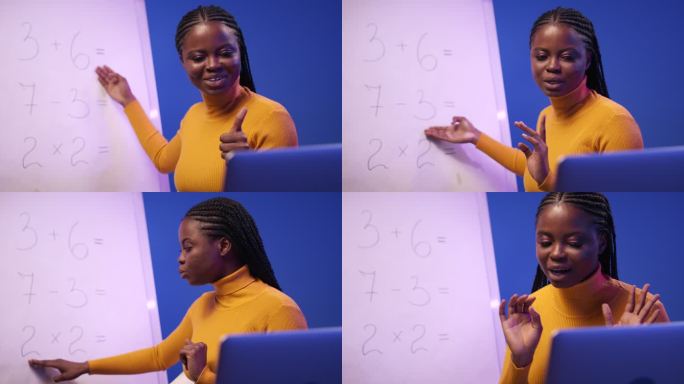 一位年轻的黑皮肤女教师正在为小学生上远程在线数学课，她拿着例子和亮蓝色背景对着黑板