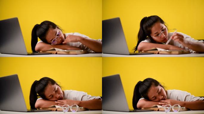 瞌睡的哈欠不努力睡觉，努力工作的女孩在办公室里用笔记本电脑工作，而且很困