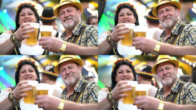 巴西圣卡塔琳娜布鲁梅瑙啤酒节上的夫妇庆祝祝酒会