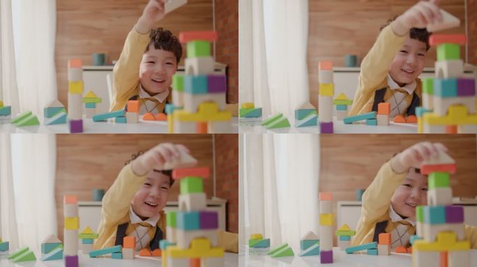 小男孩快乐地玩积木