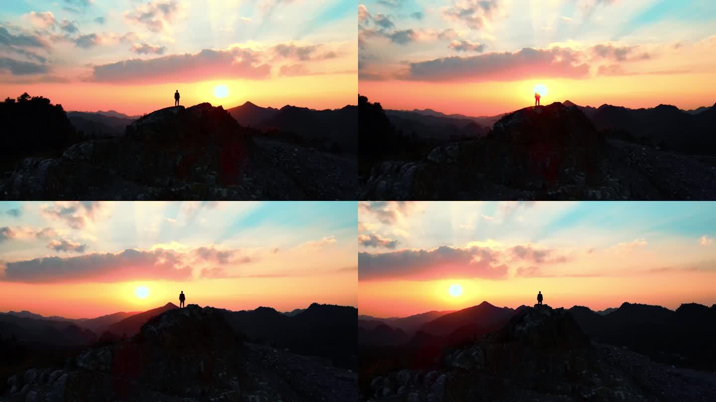 男人站在山顶眺望远方夕阳企业文化攀登剪影