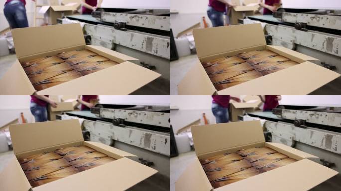 纸箱的B卷，而身份不明的工人，在印刷厂包装产品