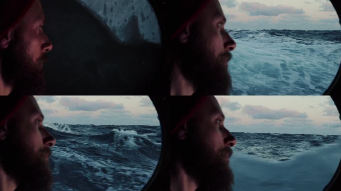 海上航行的船只舷窗上的人