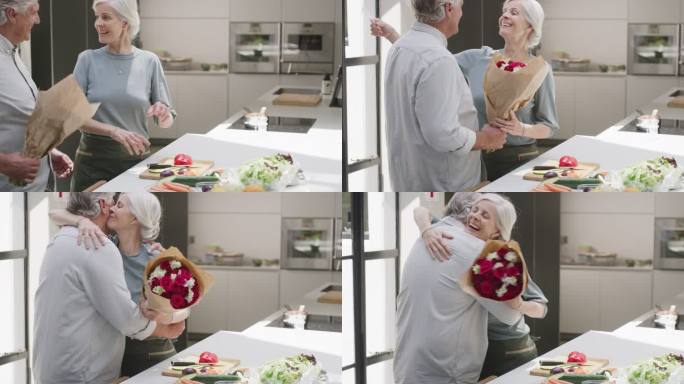 一位老人在家厨房做饭时给妻子送花。一对成熟的情侣在情人节、周年纪念日或生日时送上惊喜礼物