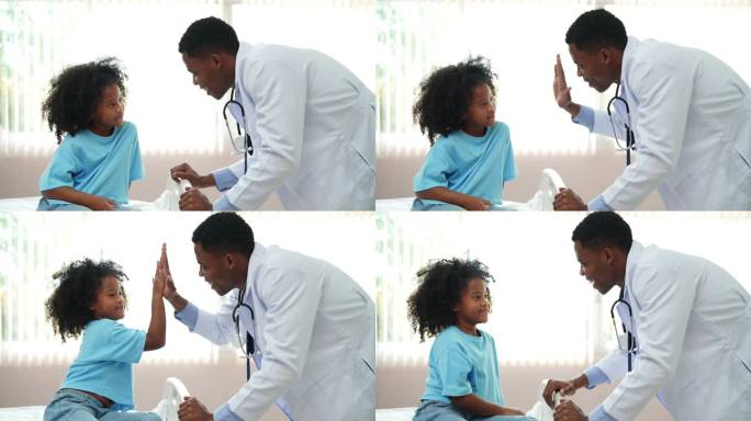 快乐的拉丁美洲医生在医院给一个小病人击掌
