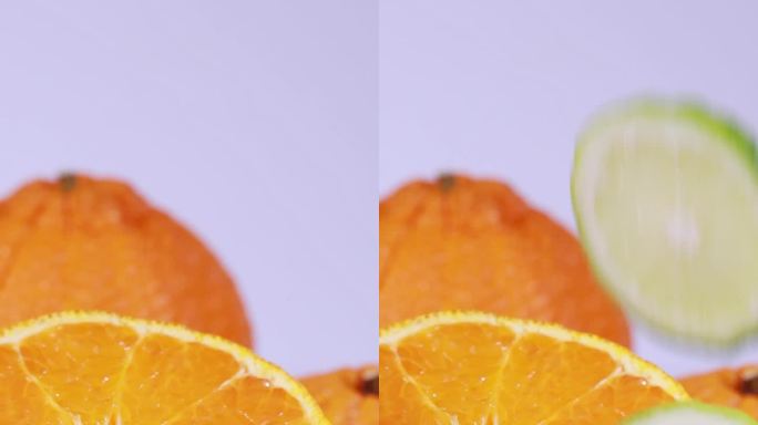 柠檬片掉落在橘子切面上