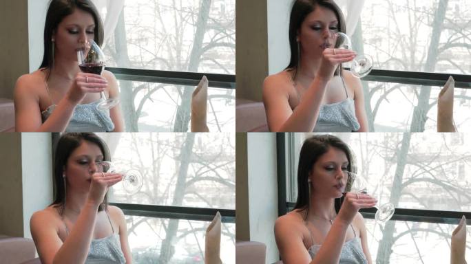 美丽的女人享受一杯红酒库存视频