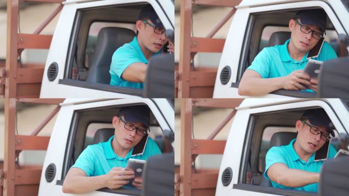 亚裔中国成熟男性送货员在送货车司机座位上用电话与顾客沟通