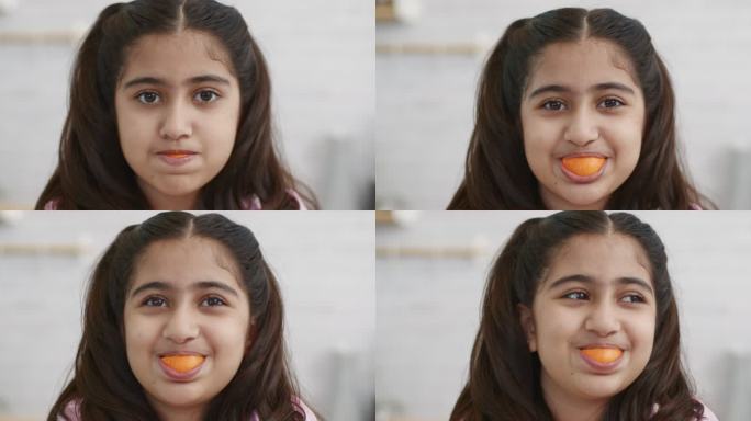 女孩面颊橙色，微笑着看着相机