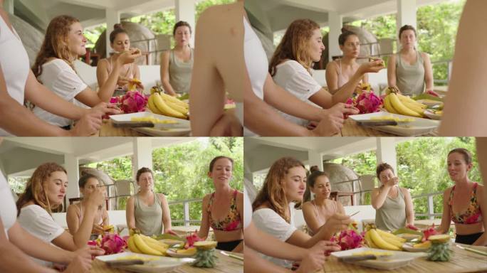 瑜伽课结束后，多种族年轻女性吃热带水果