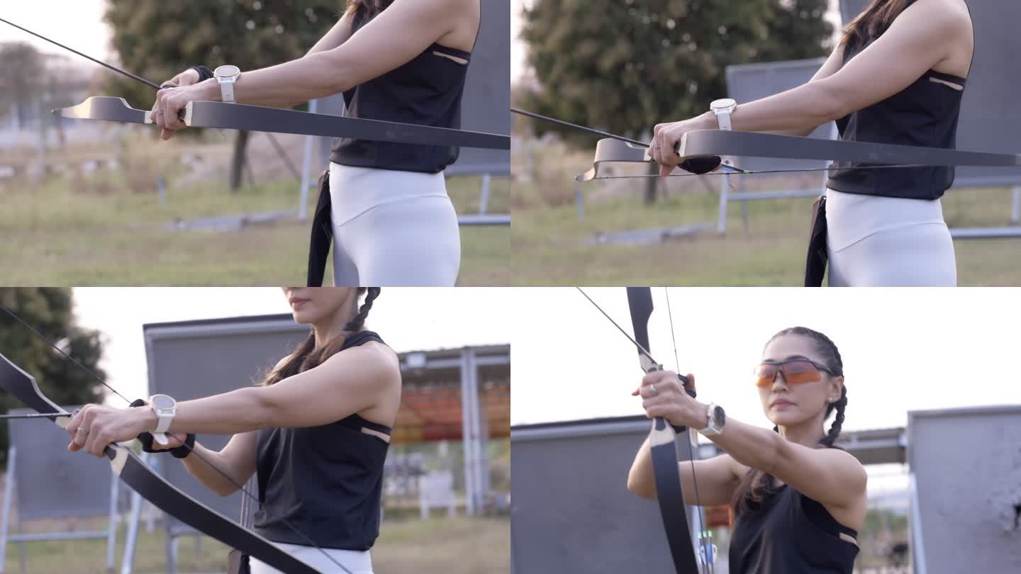 近距离拍摄迷人的亚洲女性在靶场练习射箭。