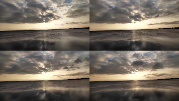 夕阳透过云层照射海面延时摄影4K高清原创