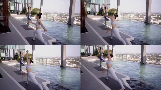 两位亚洲女性在一家豪华酒店练习瑜伽。