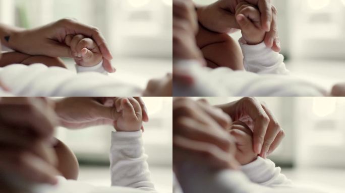 小宝宝握住妈妈的手指