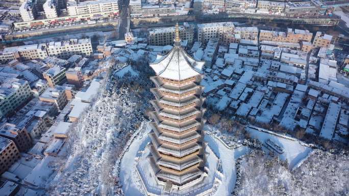 子长市安定塔带城市雪景航拍