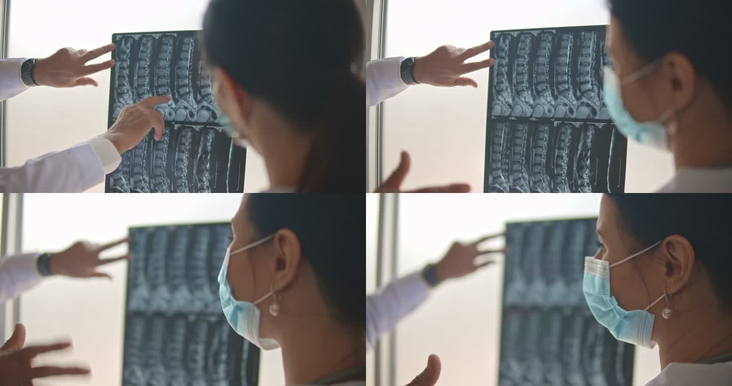 医生检查患者的x光片并讨论