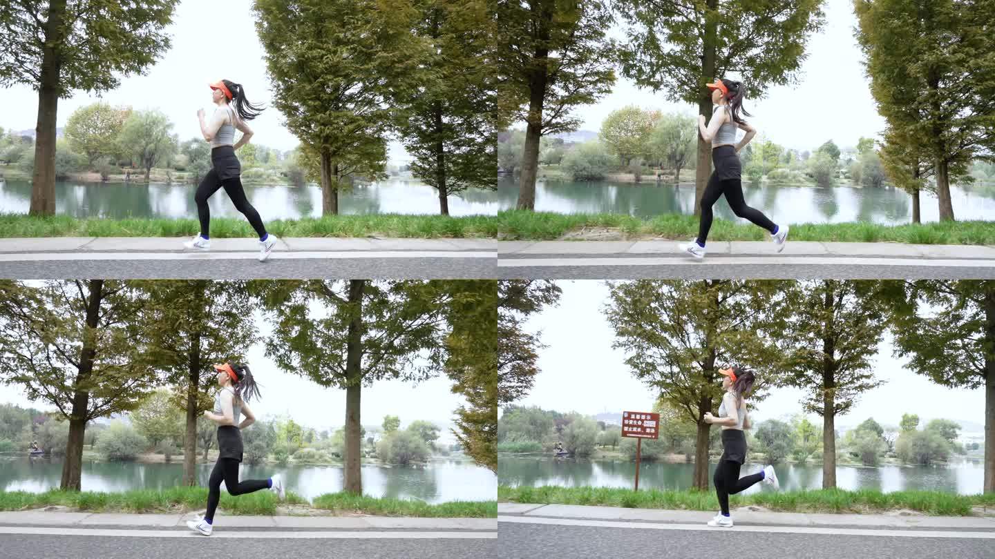 城市女白领跑步湿地公园河边跑步有氧运动