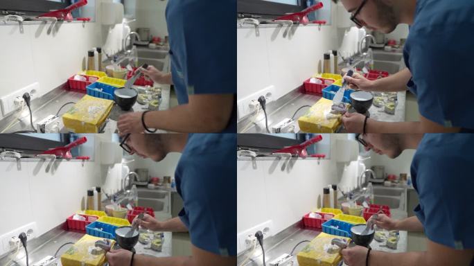 男性技师，在牙科实验室，制作牙齿印记