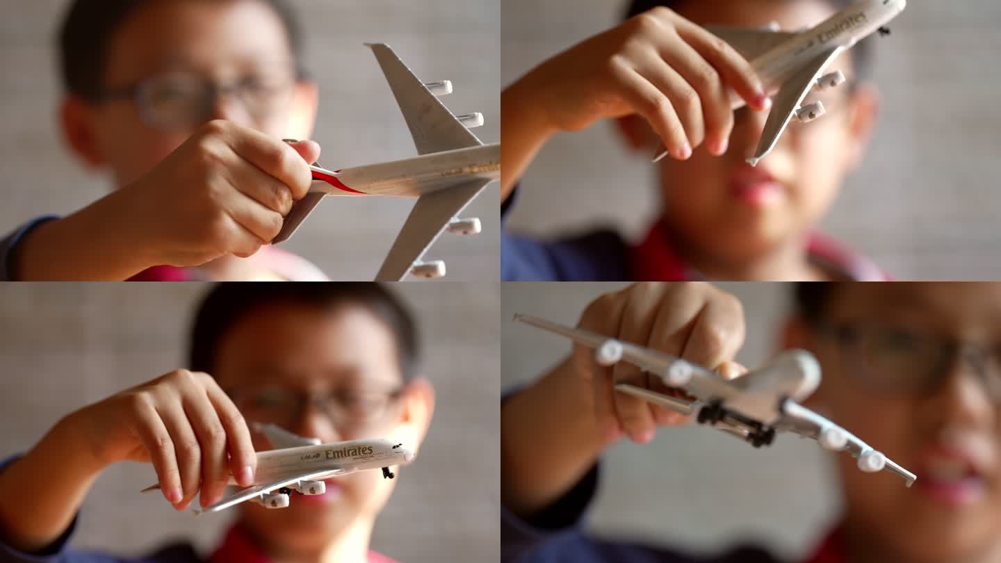 4K男孩玩飞机模型升格空镜