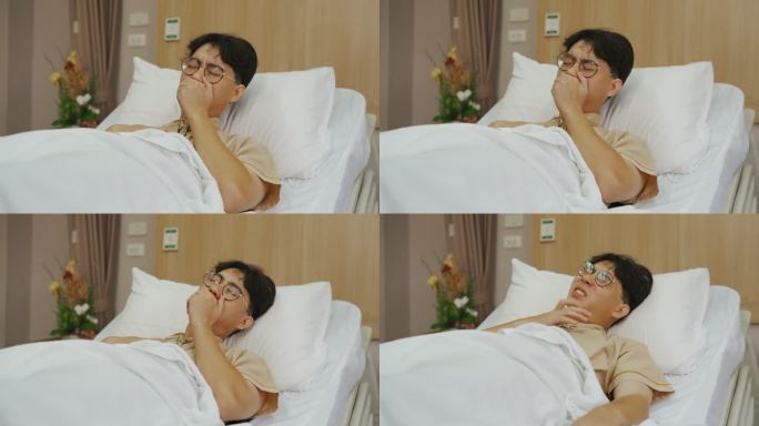 亚洲病人躺在医院的房间里