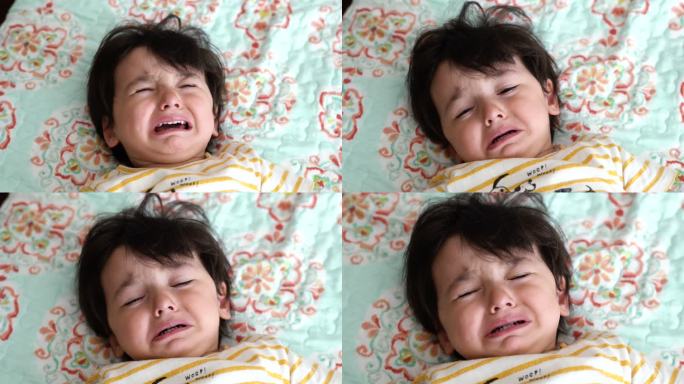 婴儿躺在床上哭泣，4K视频