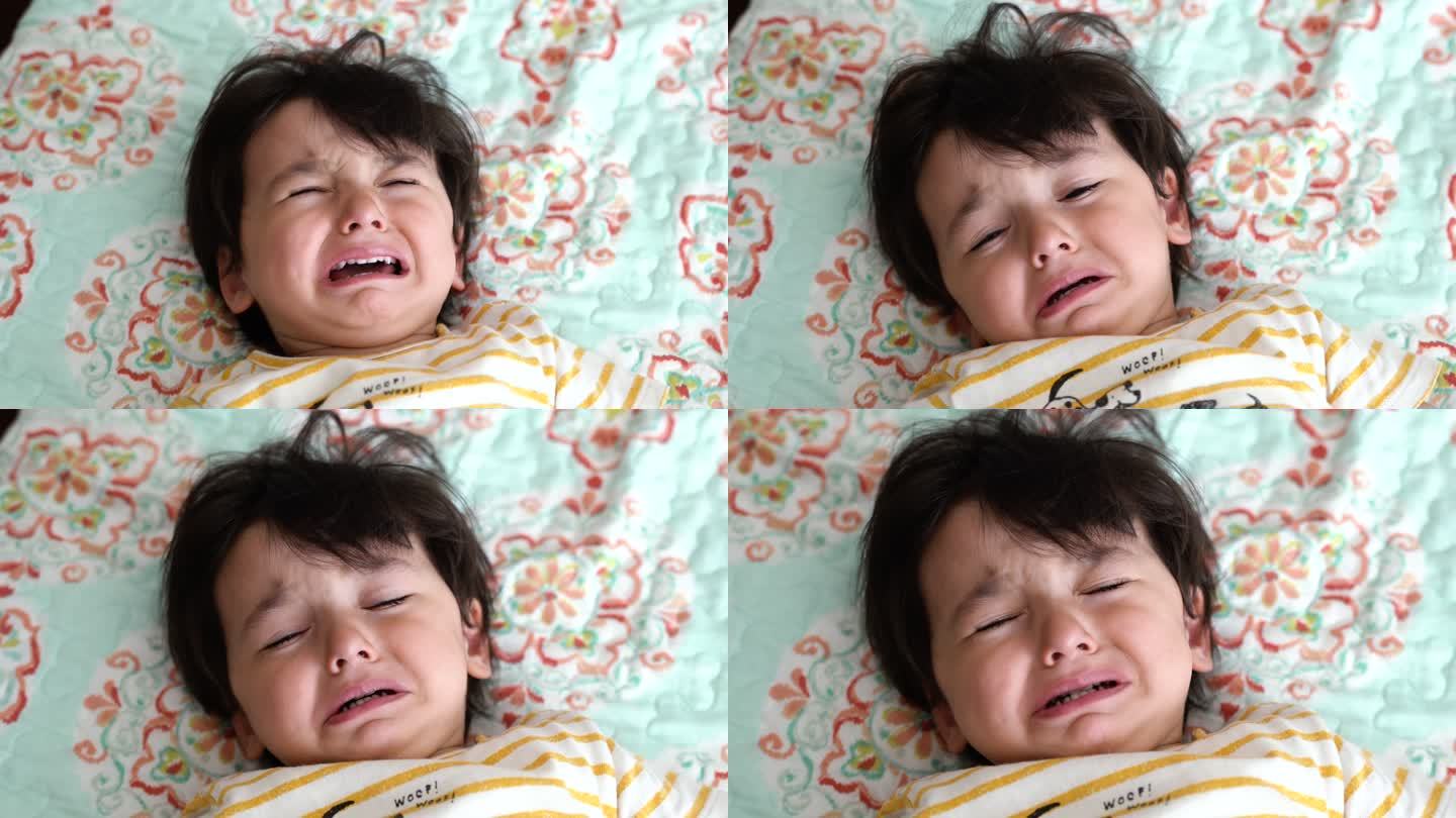 婴儿躺在床上哭泣，4K视频