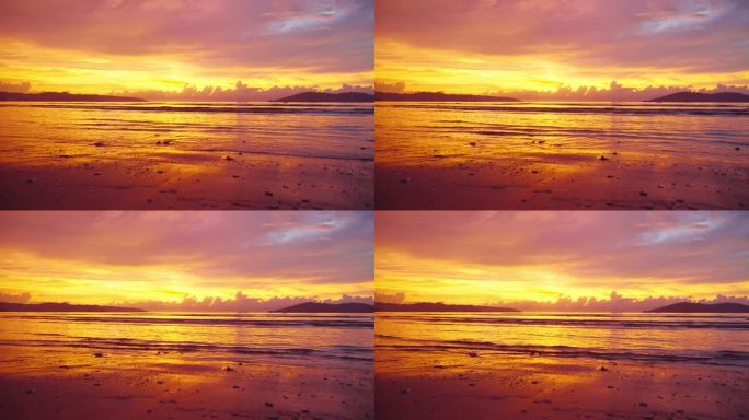 马来西亚沙巴州黄昏沙滩、海浪与火烧云