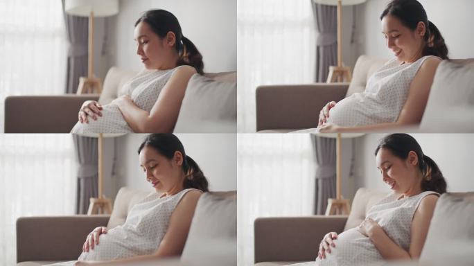 孕妇在手机上观看她的宝宝的超声波视频