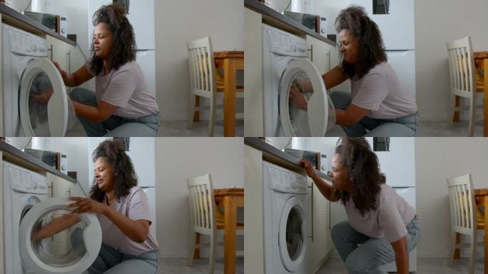 年轻人的家庭生活洗衣服滚筒洗衣机家庭妇女