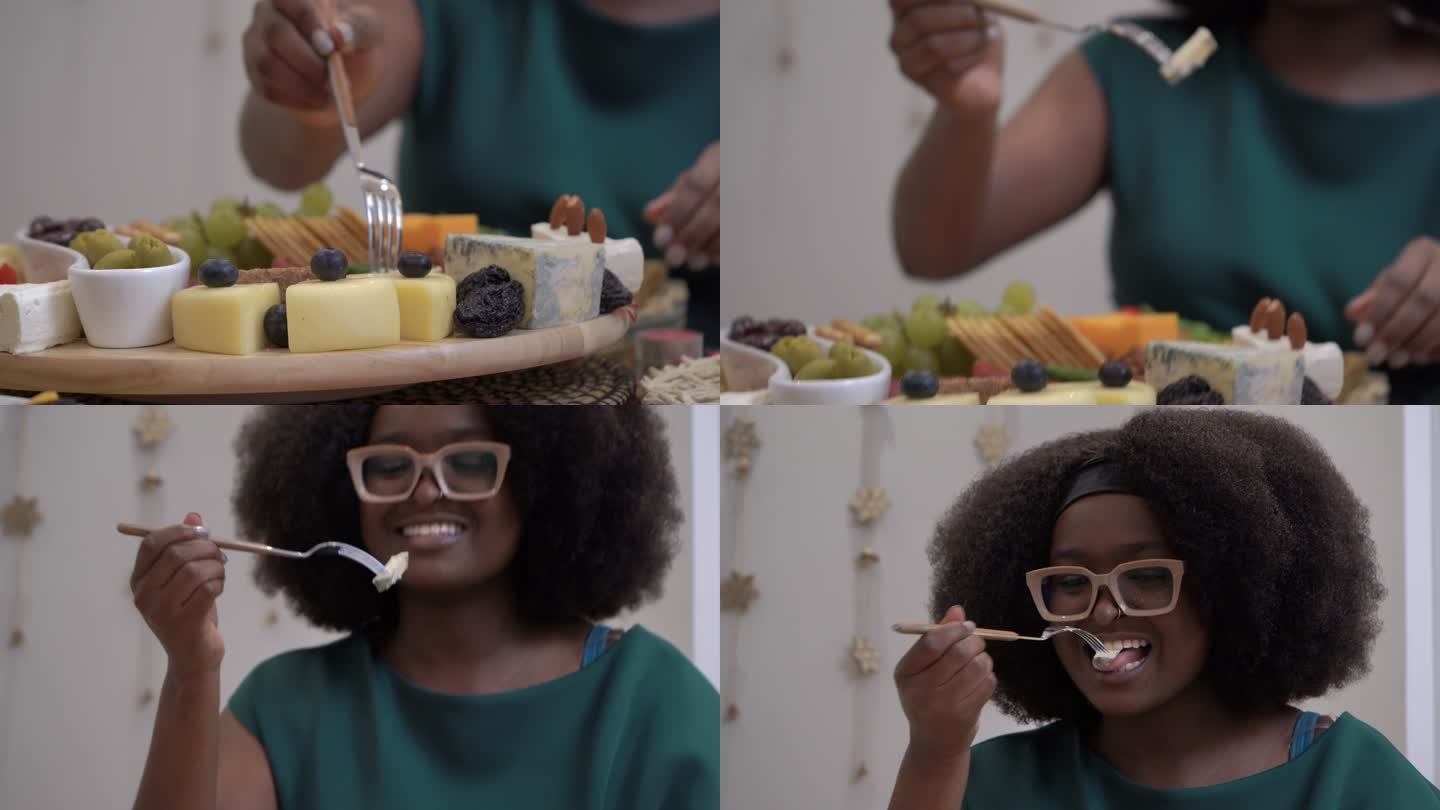 漂亮的黑人妇女在新年聚会上吃东西