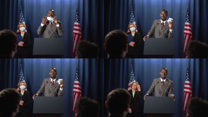 非裔美国政治家摘下防护面具，在辩论中开始演讲