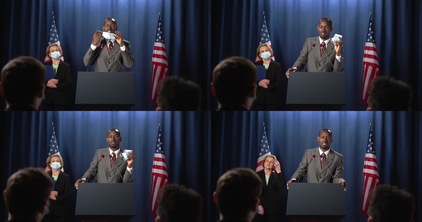 非裔美国政治家摘下防护面具，在辩论中开始演讲