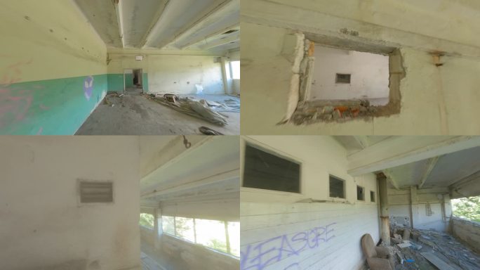 废弃的仓库，走廊和房间被毁。FPV无人机探索内部