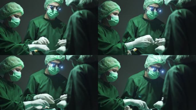 4K男外科医生在手术室为患者进行手术，同时医疗团队在手术期间为患者提供医疗器械