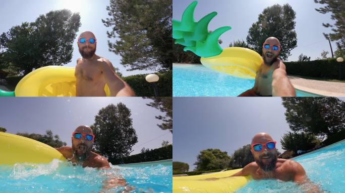 男子在游泳池里跳着充气菠萝慢动作