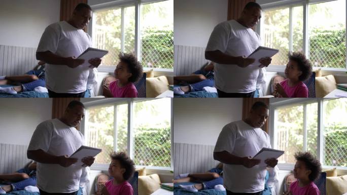 父亲帮助女儿在家学习