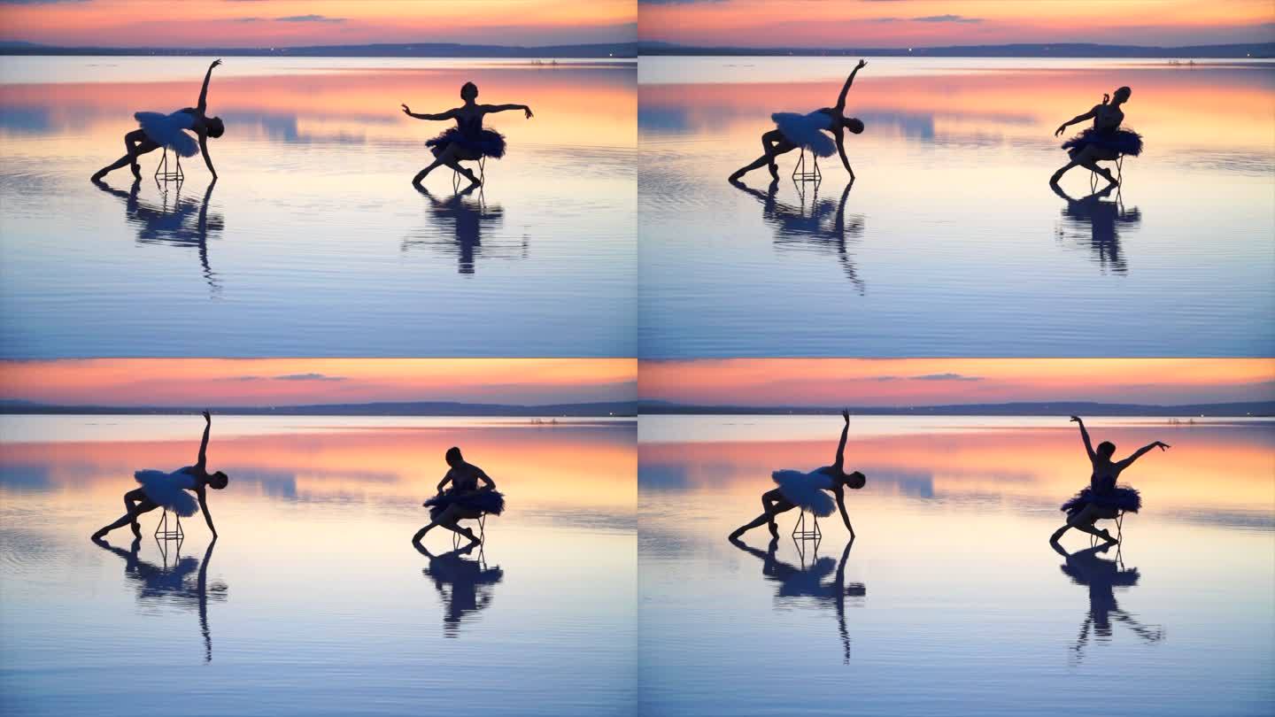 芭蕾舞演员在湖水上的椅子上摆姿势。